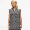 Gilet en tweed à revers pailleté Gilet en tweed à revers pailleté