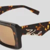 LUNETTES DE SOLEIL SIGNÉES À DÉCOUPES LUNETTES DE SOLEIL SIGNÉES À DÉCOUPES