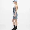 Mini-jupe en denim enduit Mini-jupe en denim enduit
