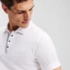 POLO À BOUTONS-PRESSIONS POLO À BOUTONS-PRESSIONS